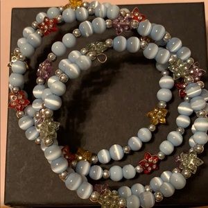Wrap around blue bead with multi color stars